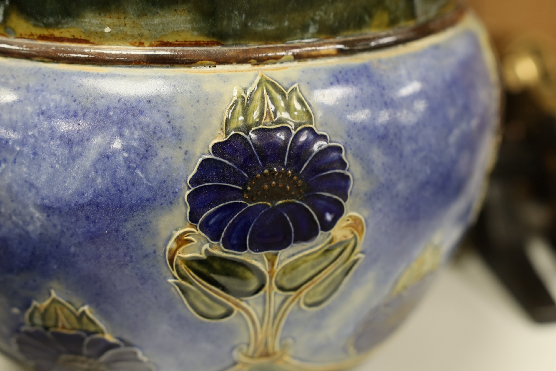 A Royal Doulton blue stoneware jardiniere by Hannah Barlow and another smaller jardiniere by Maude Bowden, largest 29cm in diameter (2). Condition - good